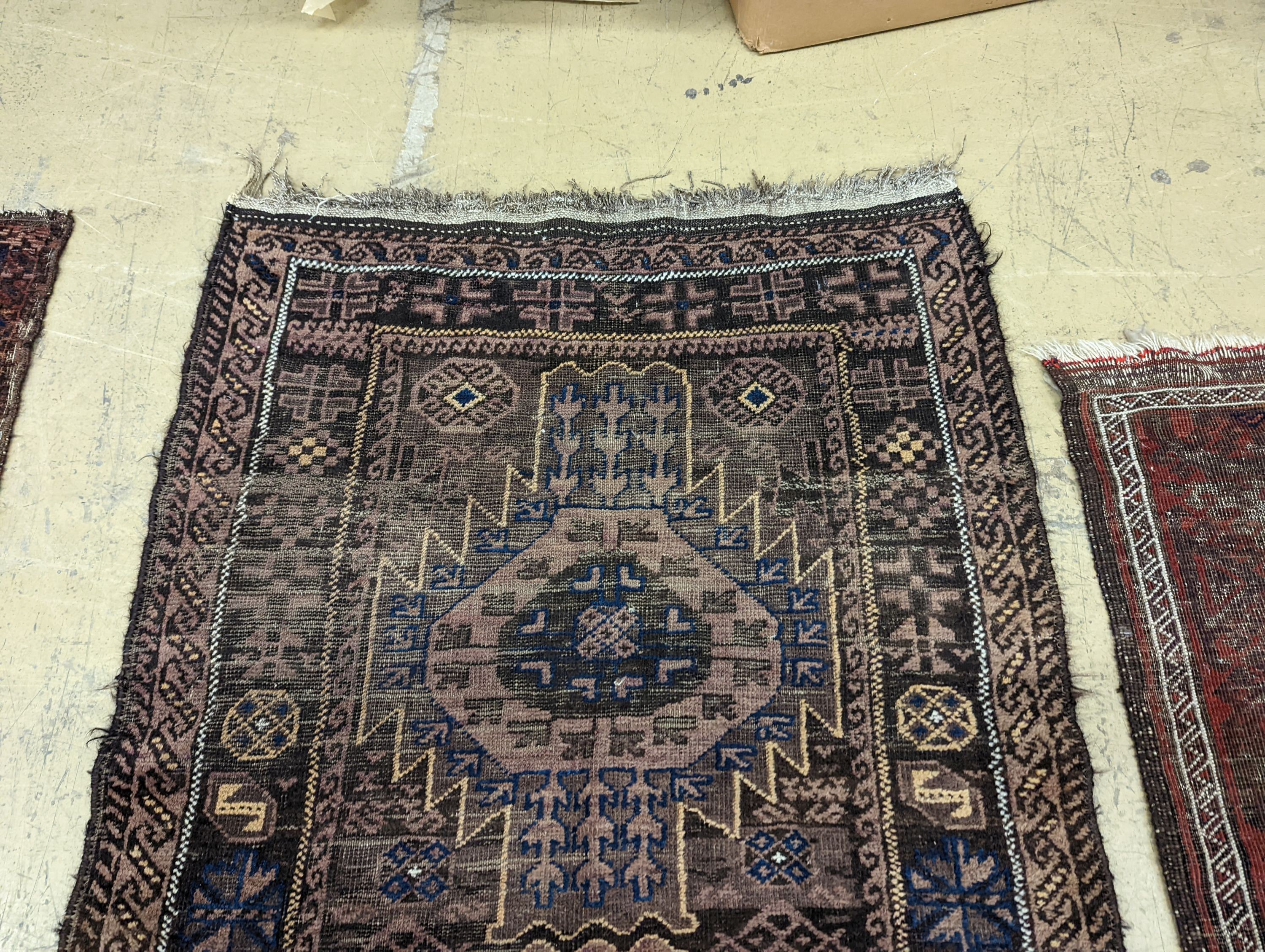 Two Caucasian geometric polychrome rugs, largest 190 x 96cm
